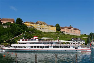 Excursion boat in the harbour, in the back Staatsweingut Meersburg and new castle
