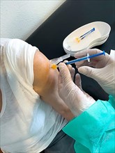 Elderly woman receives injection with medical syringe fourth vaccination booster vaccination against coronavirus disease Covid-19 C19 corona virus Corona virus, Germany