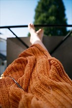 Knitted blanket with knitting needles,
