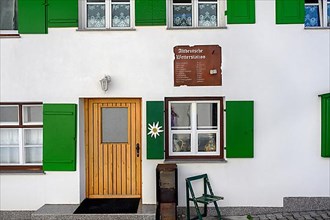 Facade with green shutters and persiflage Old German weather station, Nesselwang