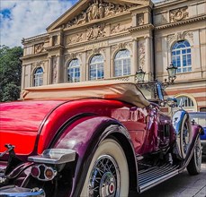 Elegant classic car in front of theatre, classic car meeting