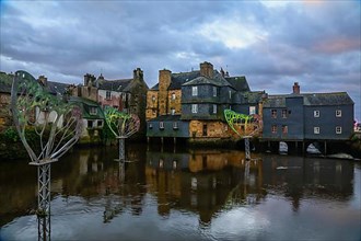 Coloured light installations at Christmas time on the Pont de Rohan bridge over the river Elorn, Landerneau