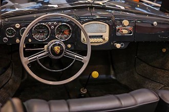 View of steering wheel and dashboard of historic Porsche 356 classic car, Techno Classica trade fair