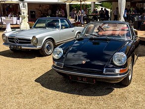 In front classic sports car Porsche 911 Urelfer from the 60s, behind historic sports car Mercedes SL