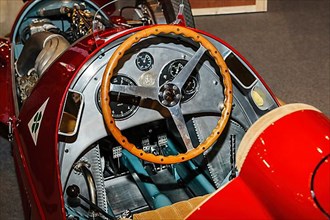 View of steering wheel and dashboard of historic Italian racing car Alfa Romeo GP Tipo 158 Alfetta first Formal 1 winner 1950 50s, Techno Classica fair