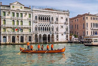 Rowing boat in front of Palazzo Ca dOro on the Grand Canal, Venice