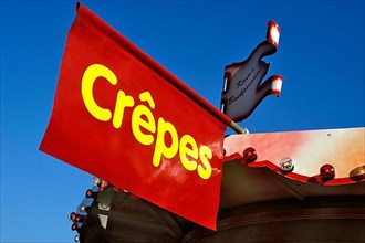 Advertising for a crepes stall at a funfair,