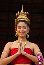 Young Thai woman in traditional costume at Siam Niramit, Bangkok