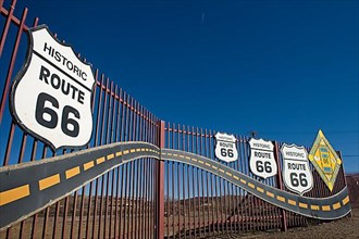 Historic Route 66 signs on fence in Gallup, New Mexico