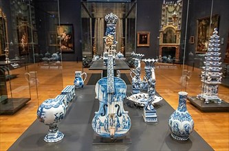 A Rijksmuseum gallery featuring Delft blue pottery in Amsterdam, Netherlands