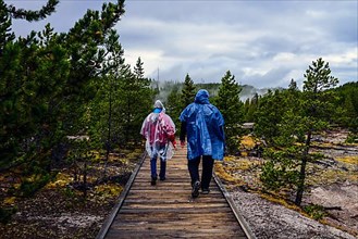 Couple of tourists in Norris Geyser Basin, Yellowstone National Park