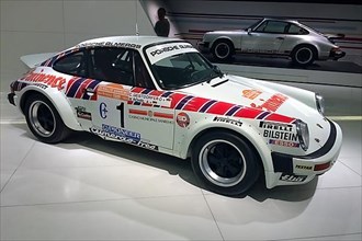 Historic racing car Porsche 911 for Rally Group 4 by Almeras Freres for Rally San Remo 1981 by driver Rally World Champion Walter Roehrl, Porsche Museum