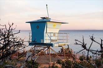 A lifeguard tower at sunset in El Matador Beach, Malibu