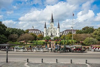 Old horse carts before Jackson square and the St. Louis Cathedral, French quarter