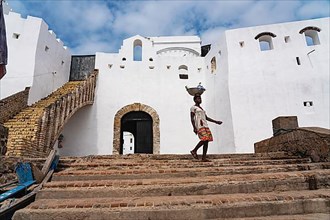 Man on stairs, entrance to Cape Coast Castle