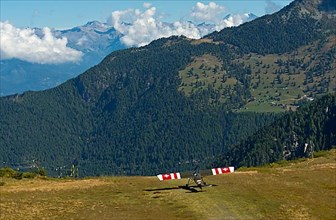 Vintage aircraft Slepcev Storch Mk IV HB-YKQ takes off from the Croix-de-Coeur mountain landing field Verbier, Verbier