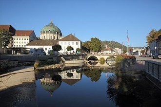 Reflection of the cathedral in the river Alb with bridge in St. Blasien, Southern Black Forest