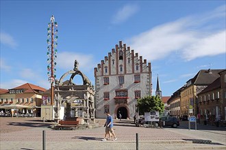 Market square with neo-Gothic town hall, fountain and maypole in Hammelburg