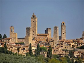 UNESCO World Heritage San Gimignano. The small town in Tuscany with a medieval city centre is also called "Medieval Manhattan" or the "City of Towers". The town is located in the province of Siena, Sa...