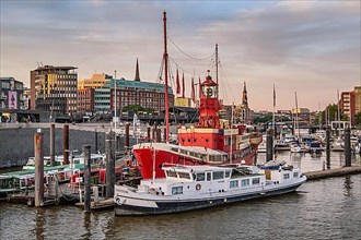 Museum lightship and launches on the Elbe in Hamburg harbour in the evening sun, Hamburg