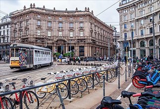 Tram and rental bikes in Piazza Cordusio in the centre, Milan