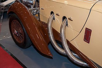 Detail of bonnet with visible exhaust pipes from historic classic sports car Classic Car Roadster Lagonda LG 45 Rapide from 30s 1937 by Clark Gable, constructor W. O. Bentley