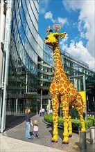Giraffe made of Lego bricks in front of the entrance to Legoland at the Sony Center, Potsdamer Platz