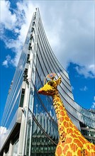 Giraffe made of Lego bricks in front of the entrance to Legoland at the Sony Center, Potsdamer Platz
