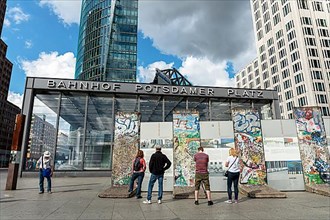 Tourists at Potsdamer Platz station, remains of the Berlin Wall