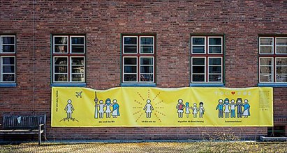 Yellow poster at a migratory centre in Kreuzberg, Berlin