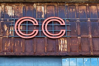 Facade of an old industrial hall with logo CC, Copenhagen Contemporary