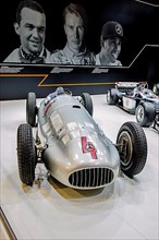 Historic Mercedes Silver Arrow racing car of Rudolf Caracciola, in the background photo from left Rudolf Caracciola