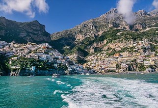Village view from the sea with the mountain backdrop, Positano