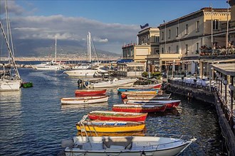 Fishing port Santa Lucia with restaurant terraces, Naples
