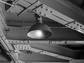 Black and white, old ceiling lighting in a factory