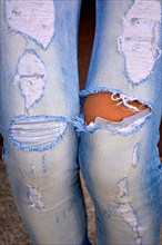 Jeans with frayed holes