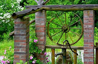 Old wagon wheel at the fountain