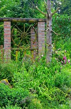 Nature garden old wagon wheel