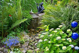 Hydrangeas Blooming by the Garden Stream Black Garden Figurine with Transverse Flute