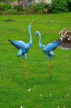 Metal Heron Figures in the Garden