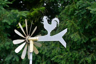 Windmill in the garden with weathercock
