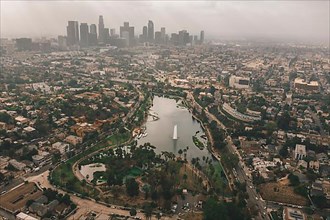 Echo Park in Los Angeles with View of Downtown Skyline and Foggy Polluted Smog Air in Big Urban City HQ