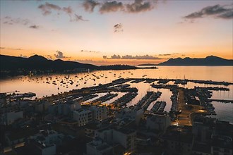 AERIAL View over Golden Sunset in Harbor Bay with Boats in Spain HQ