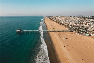 Aerial View over Manhattan Beach in California with Green Blue Water and Blue Sky near Los Angeles