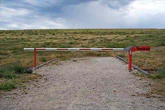 A barrier prevents people from entering a landfill site
