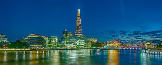 London on the Thames by Night with Cityhall and The Shard London England