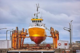 Yellow ship in dry dock