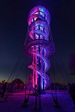 Colourfully illuminated Schoebuchturm observation tower at night