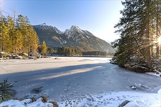 Views of the icy Hintersee lake in winter landscape