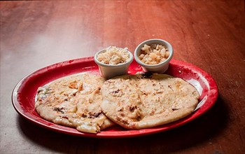 Traditional pupusas served on a wooden table